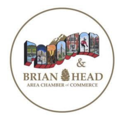 Round logo reading “BRIAN HEAD” with “AREA CHAMBER of COMMERCE” around a colorful mountain-town illustration.